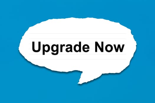 upgrade now with white paper tears on blue texture background