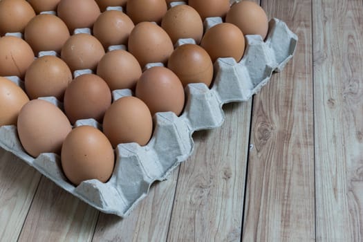 Perspective view of a big group of chicken eggs.