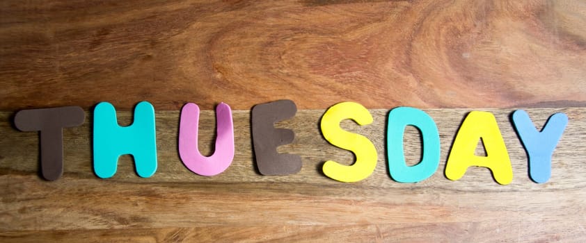 the word Tuesday in colorful letters