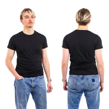 Photo of a young man posing with a blank black shirt ready for your artwork or design.