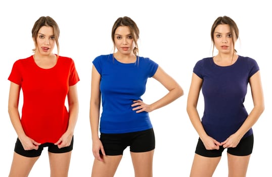 Young beautiful woman posing with a blank red, blue and purple t-shirt ready for your artwork or design.