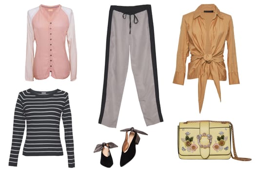 Collage woman clothes. Set of a stylish and trendy women blousescor shirts, a handbag, denim and jogging pants and other accessories isolated on a white background.