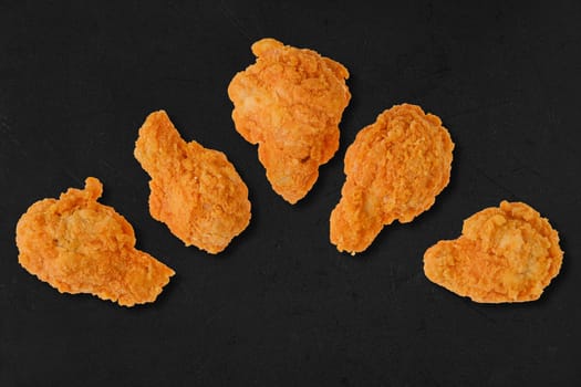 Top view of semifinished frozen chicken drumsticks ready for deep frying