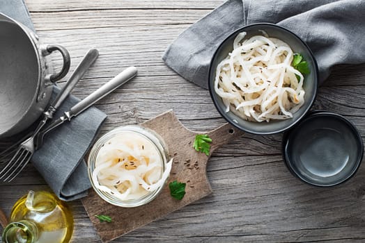 Cooking traditional meal with fresh and healthy sour turnip on wooden background