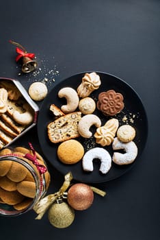Christmas winter background with tasty homemade Christmas sugar cookies of all shapes and sizes. Top view with copy space