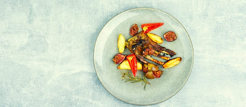 Prepared lamb meat on the ribs, fried with figs. Rack of lamb. Copy space