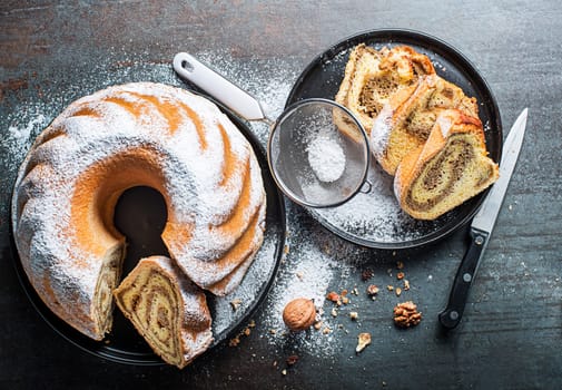 Potica, traditional Slovenian bread cake roll with walnuts. Sweet bread roll stuffed with walnuts and sprinkle with sugar