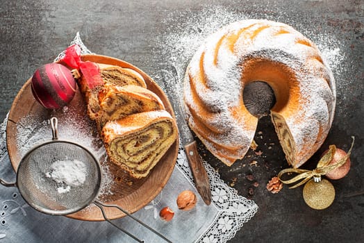 Potica, traditional Slovenian bread cake roll with , sweet bread roll stuffed with walnuts and sprinkle with sugar. Christmas holidays celebration dessert