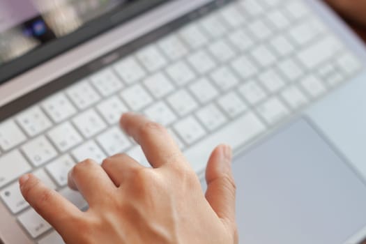 Woman working with a laptop, stock photo