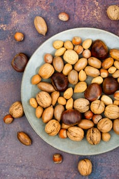 Walnut, chestnut, almond, hazelnut on the table.Healthy food and snacks