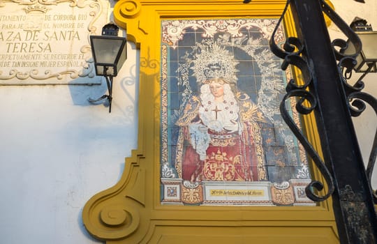 Cordoba, Spain - May 30th, 2019: Virgen del Rayo tile glazed panel, Santa Teresa Square, Cordoba, Andalusia, Spain