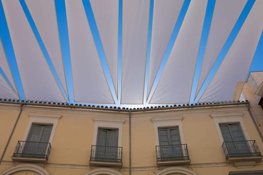 Large awnings over Lucena downtown, Spain. Pedestrian main street, covered with sun shades. Lucena, Andalusia, Spain