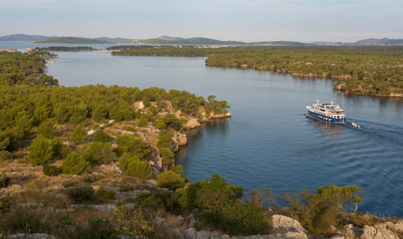 view of a boat navigating at Sveti ante canal, Šibenik, Croatia