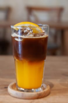 Glass of americano mixed with orange juice, stock photo