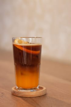 Glass of americano mixed with orange juice, stock photo