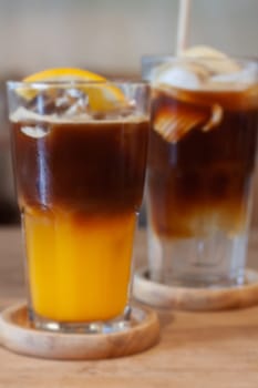 Glass of americano mixed with orange juice, stock photo