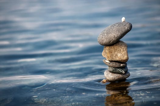 balanced stones on the rocks of the sea.