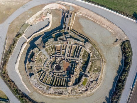 Vilars Fortress in Arbeca, Lleida Spain Iberian settlement 775 BC-300 BC, with a floodable moat 15 meters wide and four meters deep surrounding the castle. aerial view Cenit