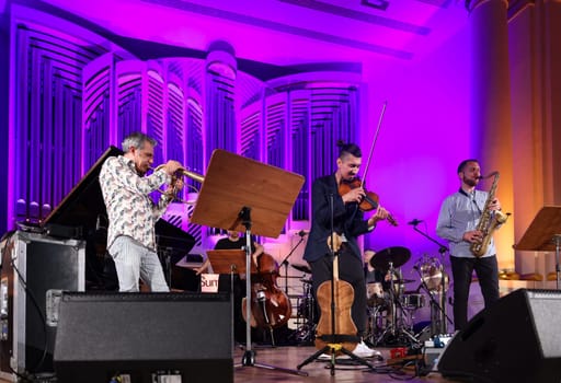Cracow, Poland - July 4, 2022: Adam Baldych Quartet and Paolo Fresu live on stage of  Krakow Philharmonic at Summer Jazz Festival in Cracow, Poland