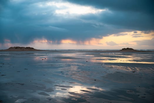 Wadden sea at low tide, North sea beach landscape, coast on Romo island in Denmark at sunset, vacation und lifestyle