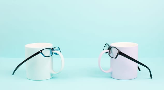Cup or mug of coffee wearing eyeglasses, funny face, hot drink for breakfast, fathers day