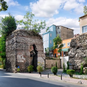 Istanbul, Turkey - August 28, 2022: Old stone bricks wall ruins at Balat district, in a sunny summer day
