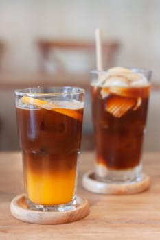 Glass of americano mixed with orange juice, stock photo