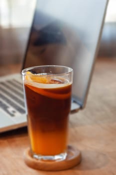 Glass of americano mixed with orange juice, stock photo