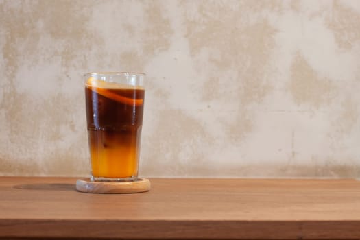 Glass of americano mixed with orange juice, stock photo
