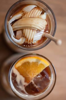 Glass of americano mixed with coconut and orange juice, stock photo
