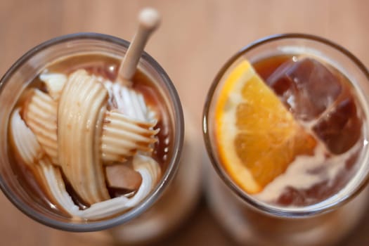 Glass of americano mixed with coconut and orange juice, stock photo