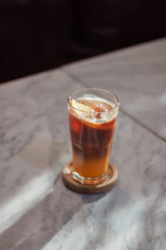 Glass of americano mixed with orange juice, stock photo