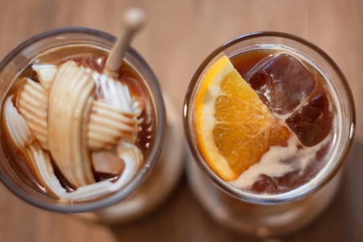 Glass of americano mixed with coconut and orange juice, stock photo
