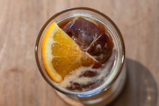 Glass of americano mixed with orange juice, stock photo