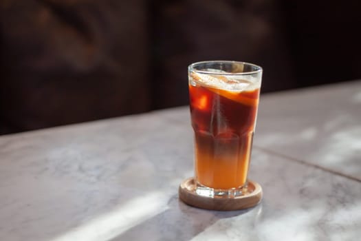 Glass of americano mixed with orange juice, stock photo
