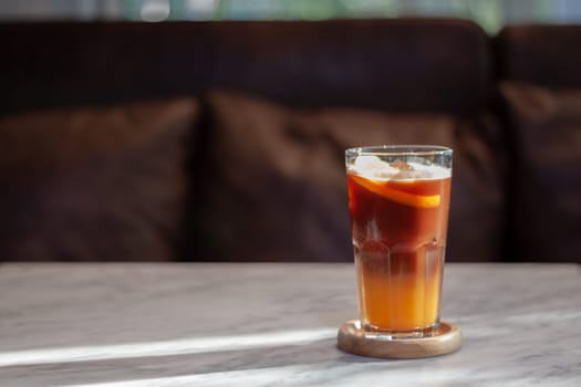 Glass of americano mixed with orange juice, stock photo