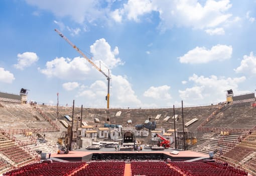 Verona, Italy - June 2022: workers preparing the stage for the thetre performance in the famous Arena