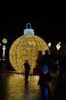 Christmas decoration with visitors on the cathedral square in Magdeburg between Christmas time and the turn of the year