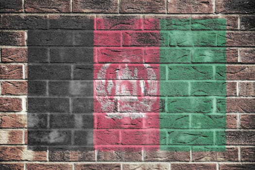 An Afghanistan flag on a brick wall background