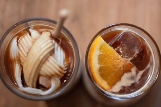 Glass of americano mixed with coconut and orange juice, stock photo