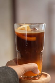 Glass of americano mixed with orange juice, stock photo