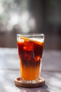 Glass of americano mixed with orange juice, stock photo