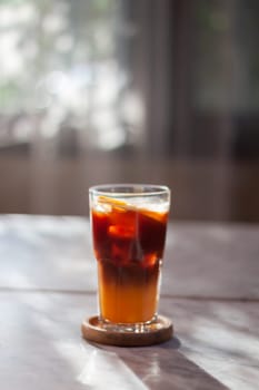 Glass of americano mixed with orange juice, stock photo