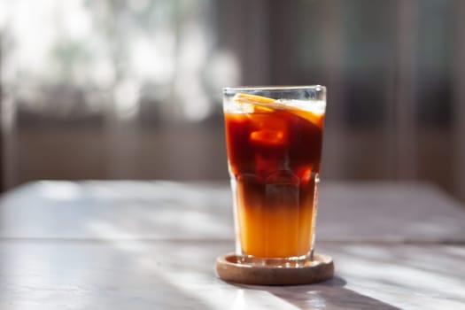 Glass of americano mixed with orange juice, stock photo