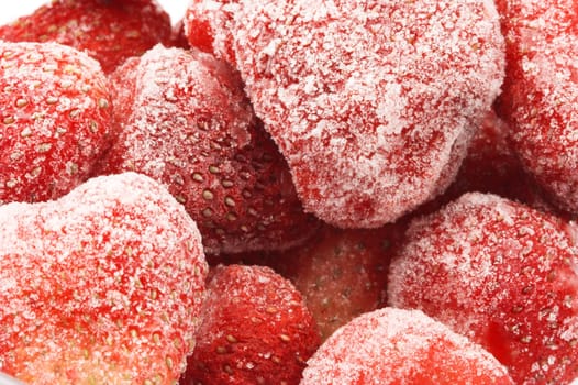 Heap of frozen strawberries closeup.