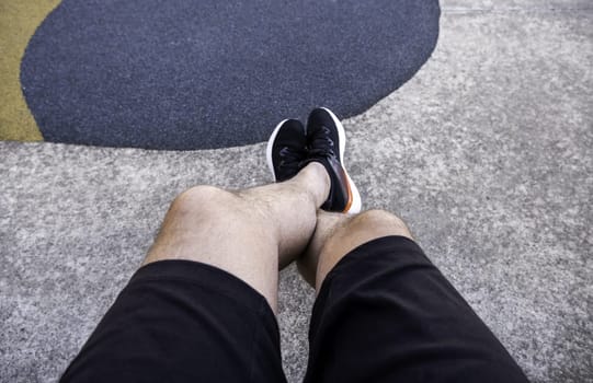 Detail of young man's feet on a cold autumn day