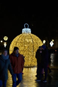 Christmas decoration with visitors on the cathedral square in Magdeburg between Christmas time and the turn of the year