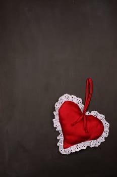 Blank chalkboard with a red cute heart shape and space for text or image