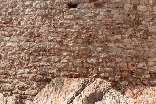 The old stone wal as background. view close-up