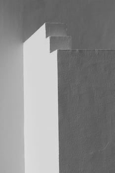 The small part of the white facade of the building in Egypt. side view